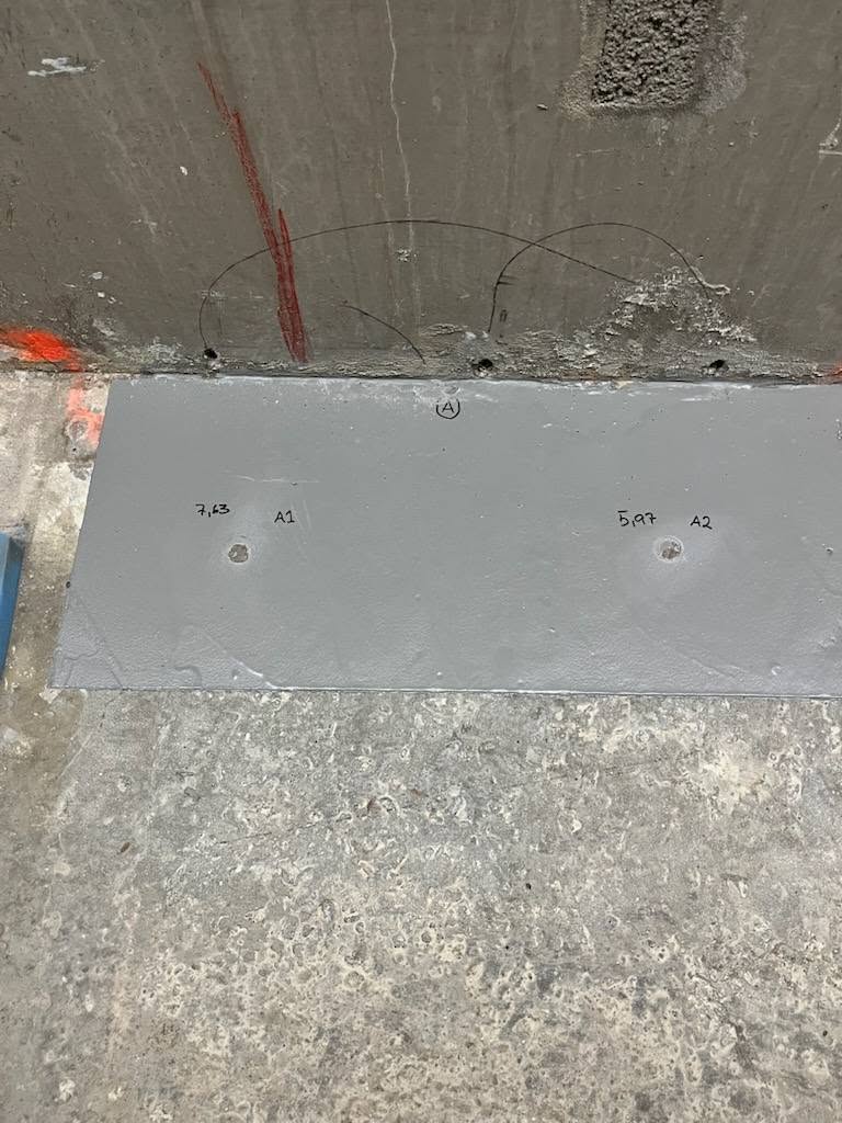 Test area in an Eskilstuna parking garage with adhesion test points A1 (7.43 MPa) and A2 (5.97 MPa) marked